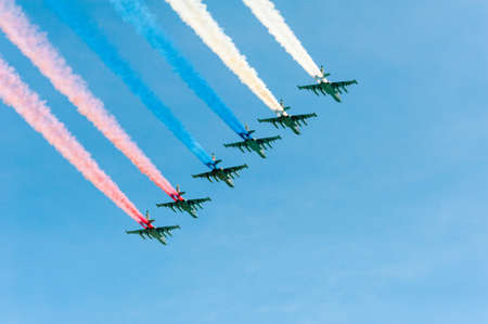 MOSCOW - MAY 7: Figters do smoke in colors of Russian flag at last rehearsal of the parade dedicated to 70th anniversary of the victory in the Second World War in Red Square on May 7, 2015 in Moscowのeditorial素材