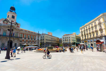MADRID - JUNE,18: Tourists visit famous place Plaza Puerta del Sol on June 18, 2015 in Madrid