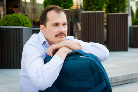 Sad middle age man portrait outdoorsの写真素材