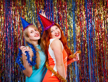 Young nice girls have fun on a dance partyの写真素材