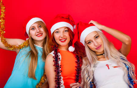Young nice girls have fun on a christmas partyの写真素材