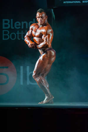 MOSCOW, RUSSIA - NOVEMBER 21, 2015: Athlete participates in Bodybuilding Champions Cup during SN Pro Expo Forum 2015 on November 21, 2015 in Moscow, Russiaのeditorial素材