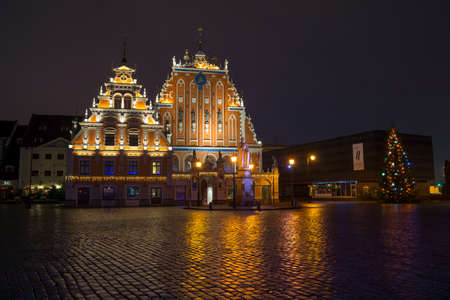 RIGA, LATVIA - DECEMBER 19, 2015: Illuminated house of the Blackheads at night on December 19, 2015 in Riga, Latviaのeditorial素材