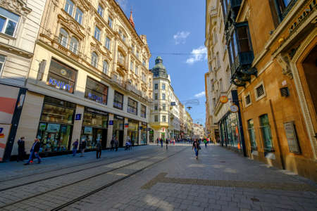 Brno, Czech Republic - April 29, 2016: People visit old city street at sunny dayのeditorial素材
