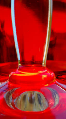 Glass on the table red wine bottle on the backgroundの写真素材