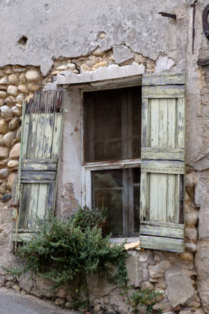 Obsolete window shutters in old city at France