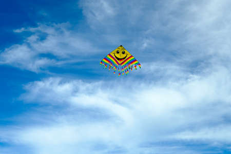 Flying kite in the blue sky. Room for textの写真素材