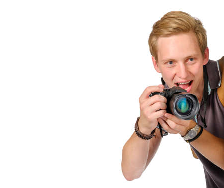 Photographer looks out over the edge with dslr camera isolated on white