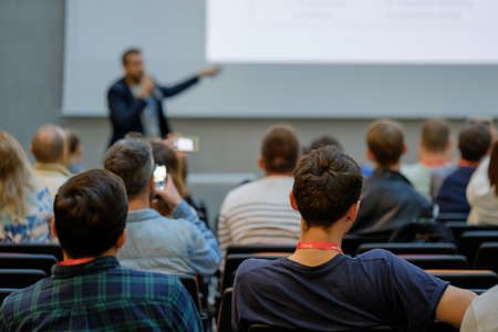 Speaker Giving a Talk at Business Meeting. Audience in the conference hall. Business and Entrepreneurship.の写真素材