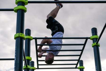 Moscow, Russia - September 10, 2016: Young man practice street workout on open competition dedicated...