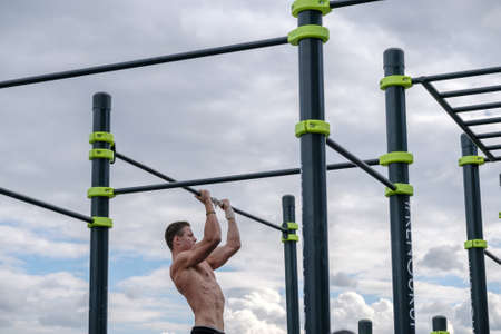 Moscow, Russia - September 10, 2016: Young man practice street workout on open competition dedicated to City Dayのeditorial素材