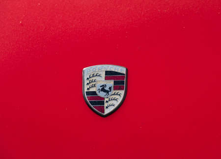 Moscow, Russia - September 10, 2016: Porsche sign on the red car hoodのeditorial素材