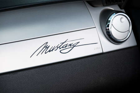 Moscow, Russia - September 10, 2016: Ford Mustang car logo on the retro car dashboardのeditorial素材