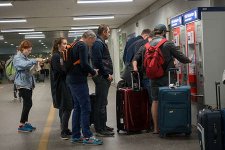 Berlin, Germany - September 19, 2016: People buying subway tickets in vending maschine at eveningのeditorial素材