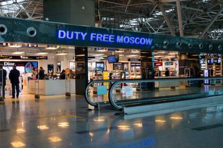Moscow, Russia - September 19, 2016: People visit duty free shop in Vnukovo airport at eveningのeditorial素材
