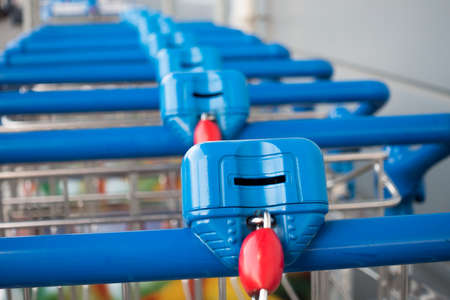 Many empty shopping trolleys in supermarketの写真素材