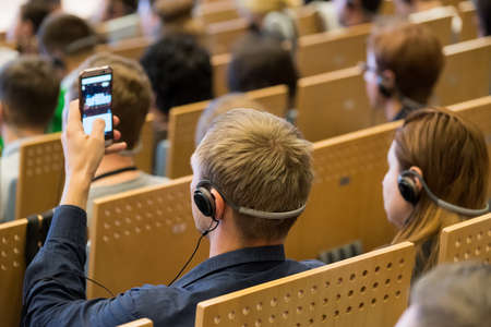 People attend business conference in the hallの写真素材