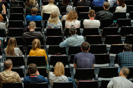 Audience at conference in a hall, top back viewの写真素材