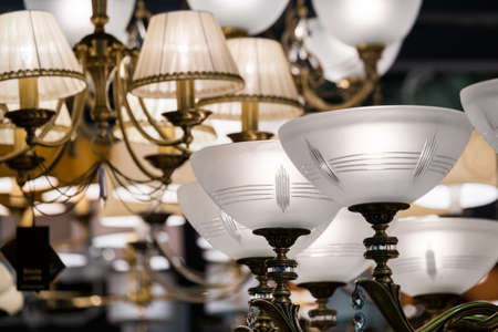 Different chandeliers in the lighting shop