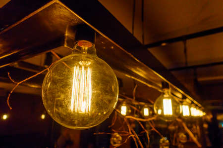Vintage incandescent lamps as decorative element in a restaurantの写真素材
