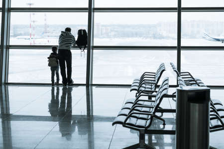 Passengers silhouette in the modern airportの写真素材