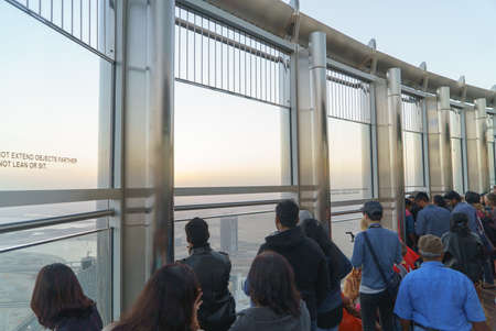 Dubai, UAE - January 06, 2017: Tourists meet sunrise at the observation deck on the 125 floor of Khalifa towerのeditorial素材