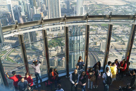 Dubai, UAE - January 06, 2017: Tourists meet sunrise at the observation deck on the 125 floor of Khalifa towerのeditorial素材