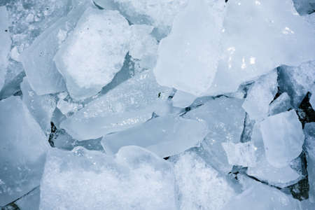 Frozen blocks of ice on the beach in winter