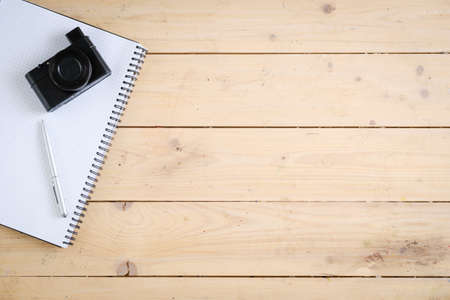 Wooden desk with various gadgets and accessories, top viewの写真素材