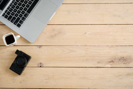 Wooden desk with various gadgets and accessories, top viewの写真素材