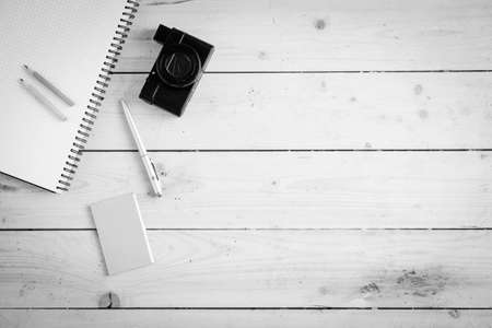 Wooden desk with various gadgets and accessories, top viewの写真素材