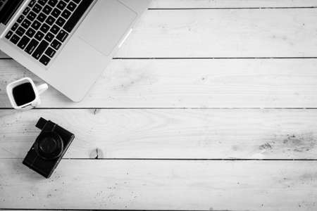 Wooden desk with various gadgets and accessories, top viewの写真素材