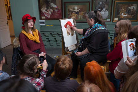 Moscow, Russia - February 18, 2017: People attend free drawing workshop during the open day in watercolors schoolのeditorial素材