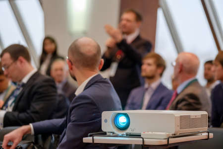 People attend business conference in congress hallの写真素材