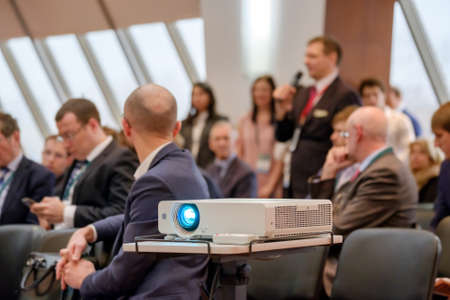 People attend business conference in congress hallの写真素材