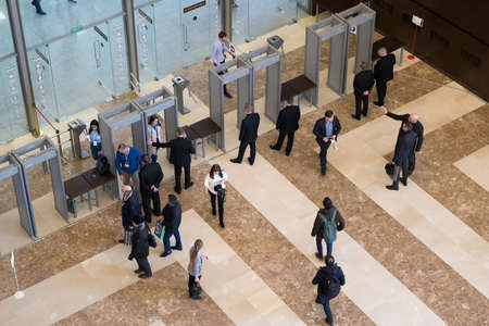 Moscow, Russia - April 24, 2017: Visitors passing security check at Synergy Global Forum at Crocus Expo Hall. This is one of the largest business forums with more than 5000 participantsのeditorial素材