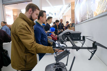 Moscow, Russia - April 1, 2017: Customers watch quadrocopters at the opening of DJI Authorized Storeのeditorial素材