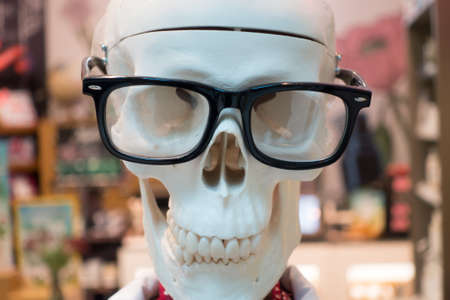 Skull face wearing the glasses