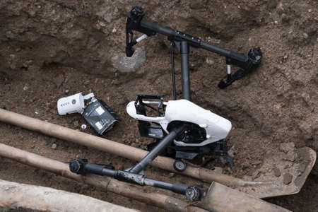 Moscow, Russia - May 28, 2017: Crashed DJI Inspire quadcopter on the construction sitelのeditorial素材