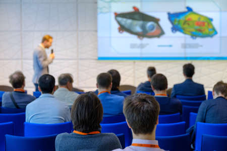 Audience listens to the lecturer at the conference hallの写真素材