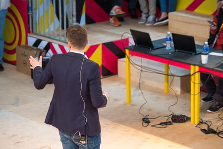 Speaker speaks speech at a conference