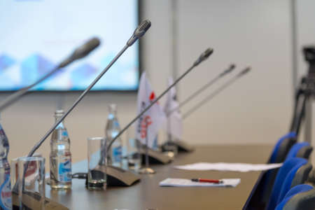 Table microphones at conference hallの写真素材