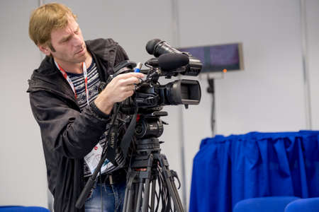 Moscow, Russia - August 31, 2017: Operator preparing tv camera to the live broadcastのeditorial素材