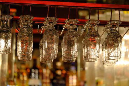 Glasses in the bar backgroundの写真素材