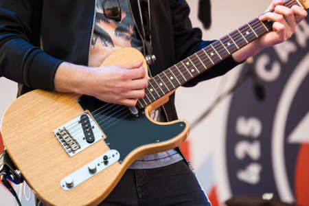Man playing electric guitar close upの写真素材