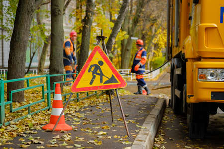 Workers conduct water pipe repair work in the streetの写真素材