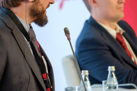 Man speaking at the conference to the microphoneの写真素材