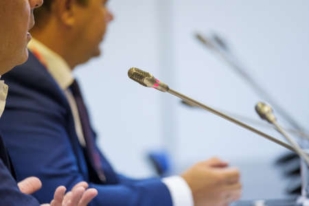 Man speaking at the conference to the microphoneの写真素材