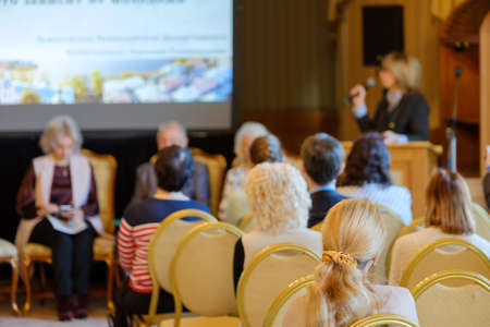 Audience listens to the lecturer at the conference hallの写真素材