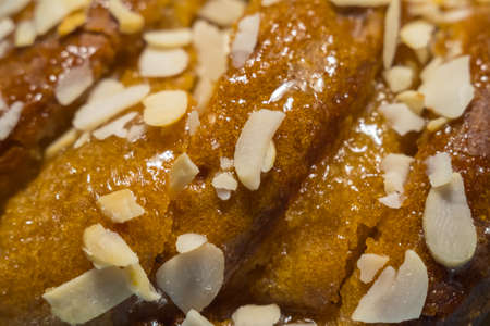 Fresh pastry crunch with maple syrup sprinkled with sliced almonds.の写真素材